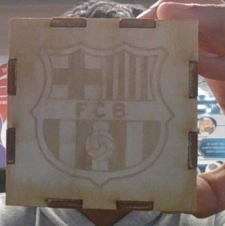 Cube face engraved with a football club crest